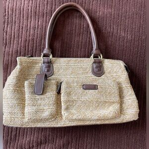 Straw purse.  Goes with everything! Measures 14” X 8”.